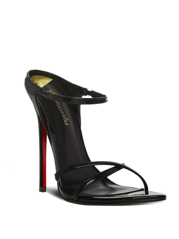 Celebrity style black slim heeled sandals with a feminine touch